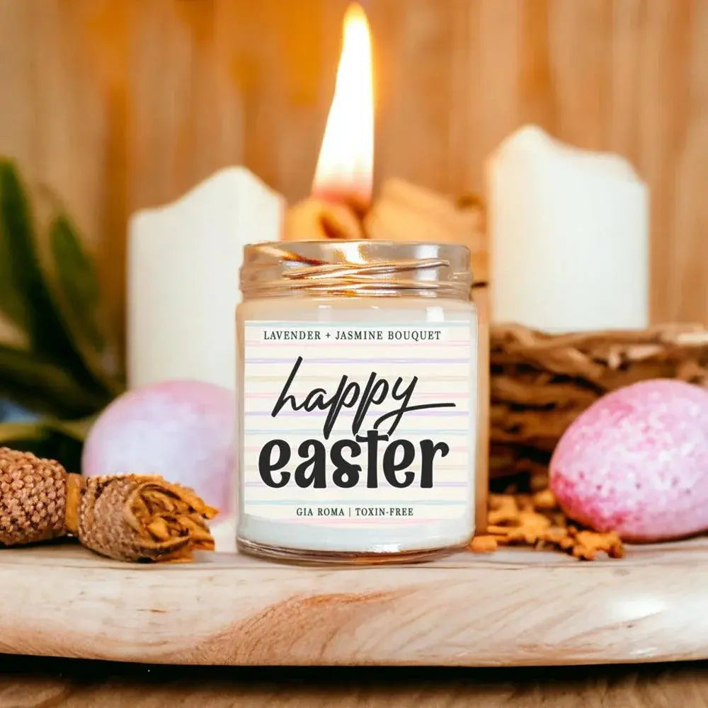 Candle labeled 'happy easter' with Easter decorations on a wooden surface