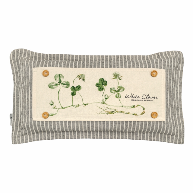 A rectangular decorative throw pillow with a gray and white striped fabric border and a central cream-colored patch featuring green clover illustrations and the text 'White Clover'.