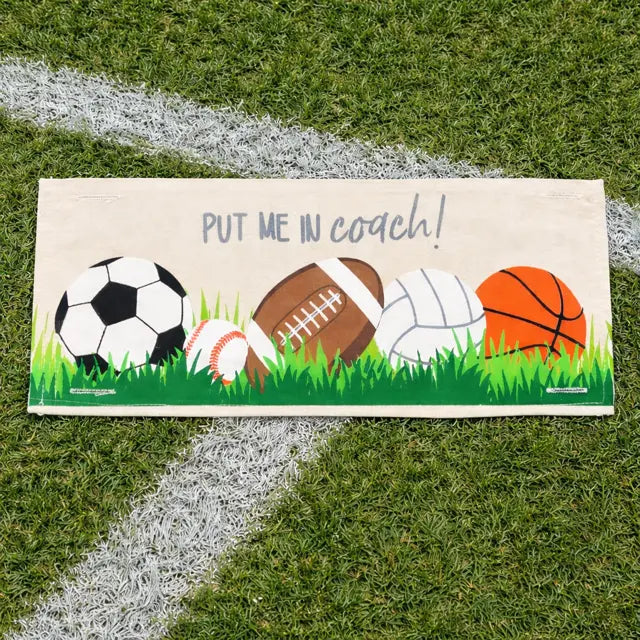 Sports-themed door mat with various balls on grass