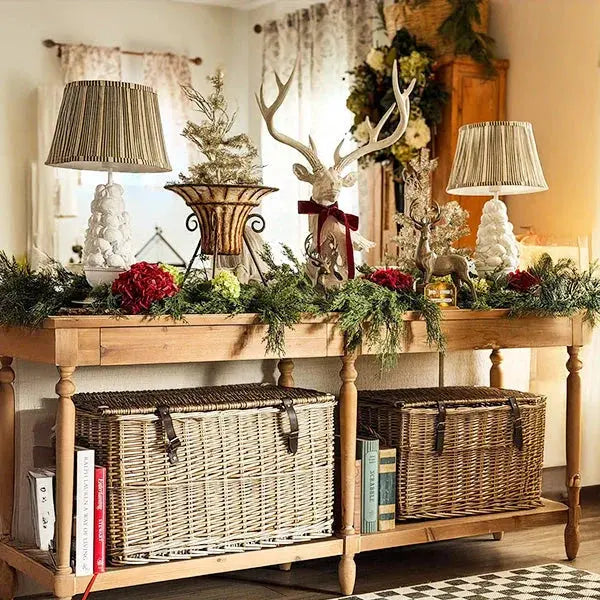 Farmhouse entryway console table with wicker baskets, deer decor, and holiday greenery for cozy cottage style