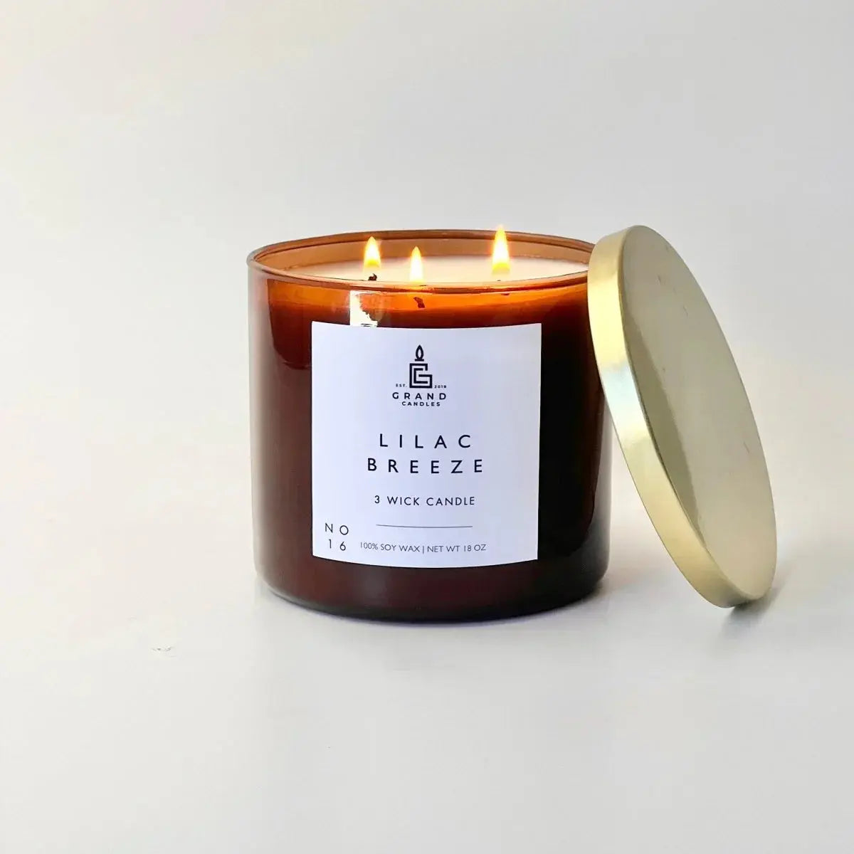 Lilac Breeze 3-wick soy candle in amber jar with gold lid, cozy home decor essential