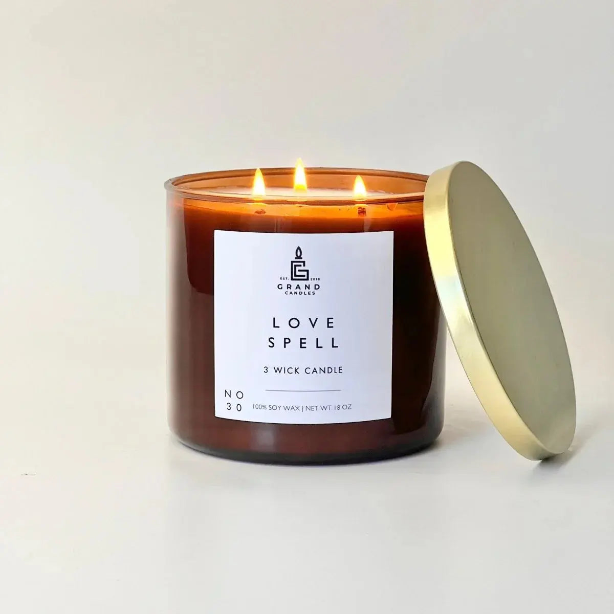 Love Spell 3-wick soy candle in amber jar with gold lid, cozy home decor