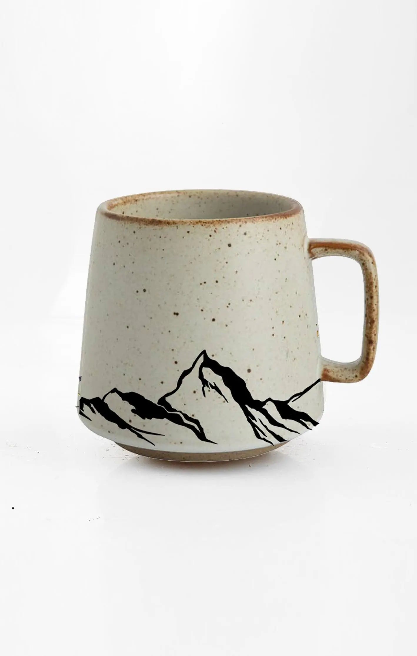 Speckled ceramic mug with black mountain range design, cozy farmhouse decor