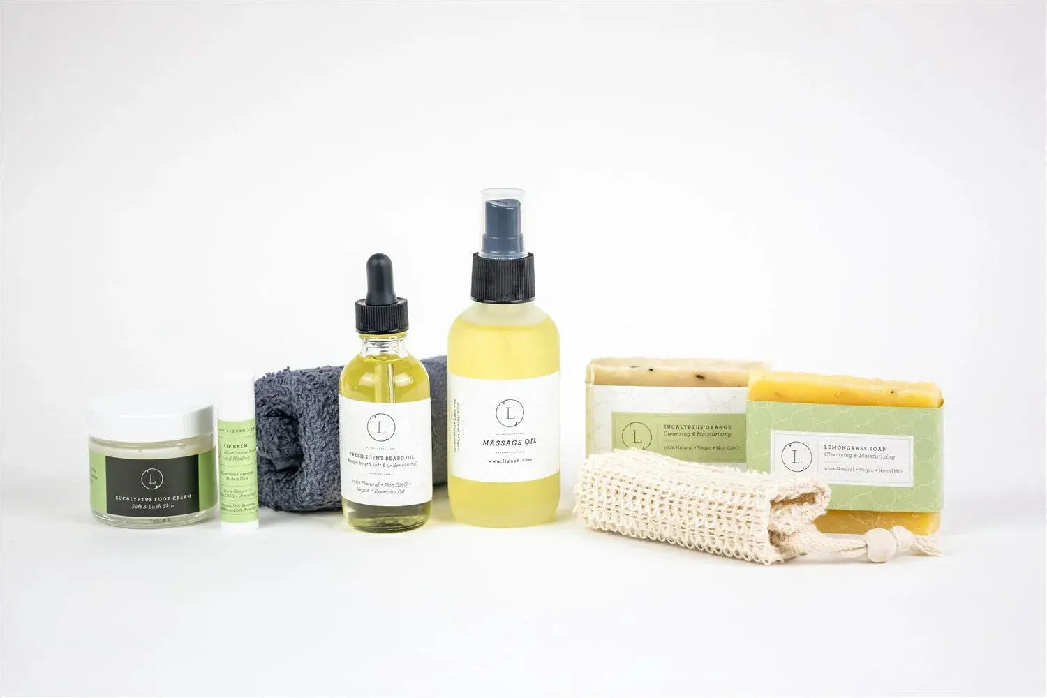 Natural bath and body set with eucalyptus foot cream, beard oil, massage oil, and lemongrass soap for cozy self-care