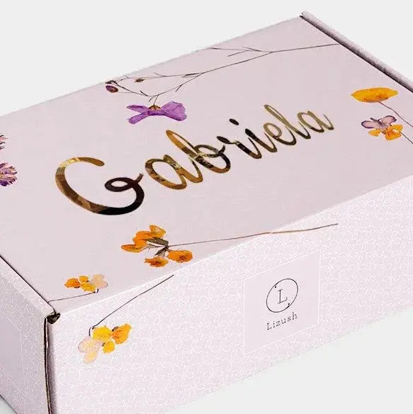 Personalized gift box with floral design and name Gabriela in gold script, perfect for cozy home decor gifting