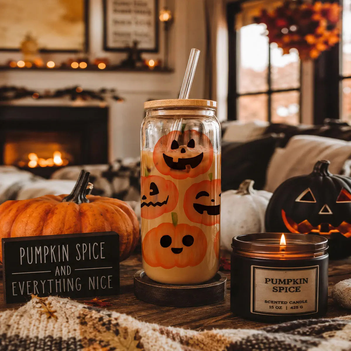 Glass jar with pumpkin spice design, pumpkin, and candle on a cozy autumnal setting.