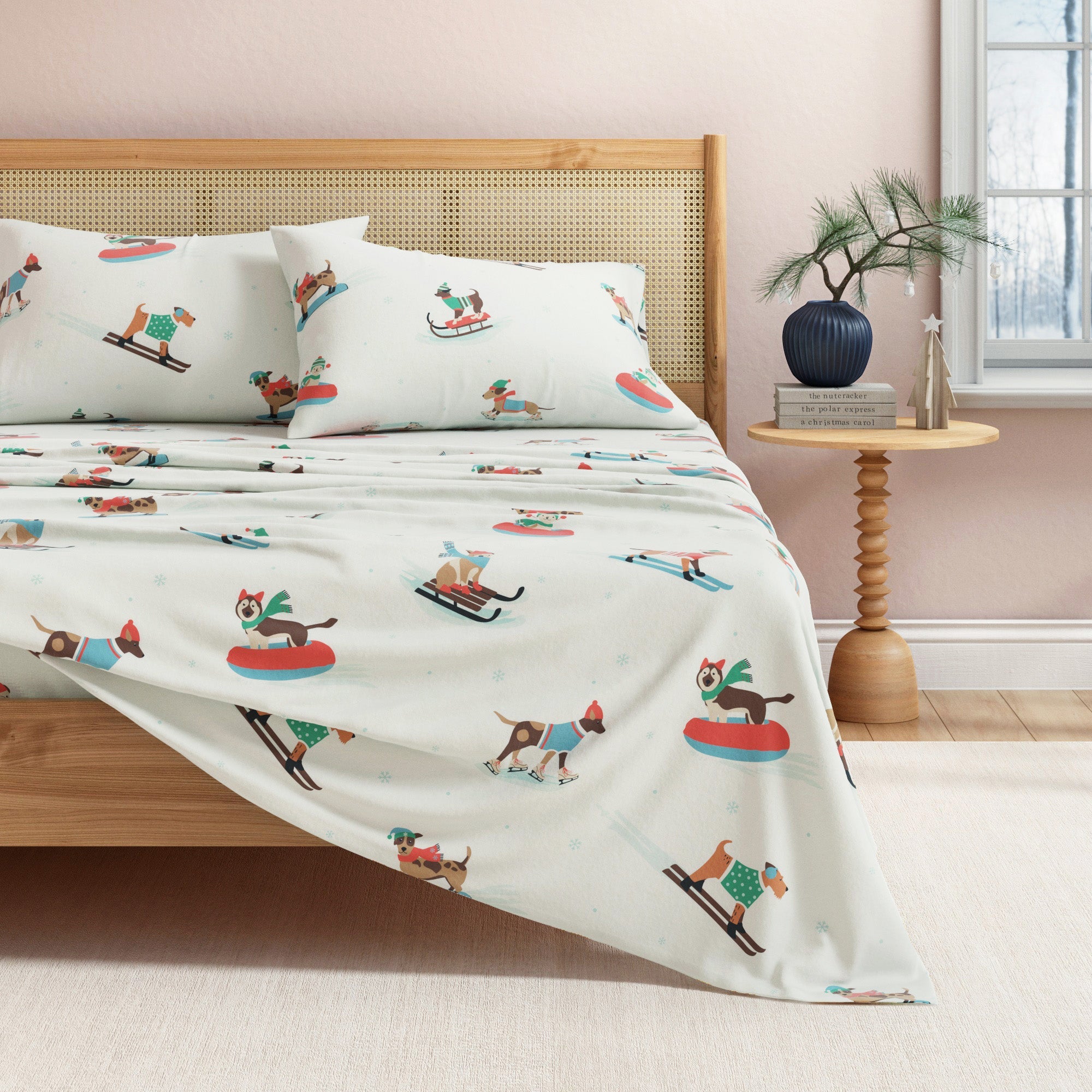 Bed with decorative bedding featuring winter sports-themed design, wooden headboard, and side table.