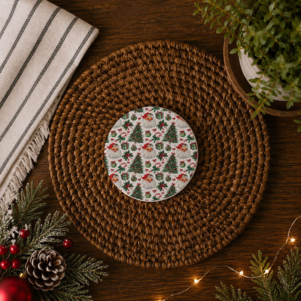 Round ceramic plate with Christmas pattern on a woven placemat with festive decorations.