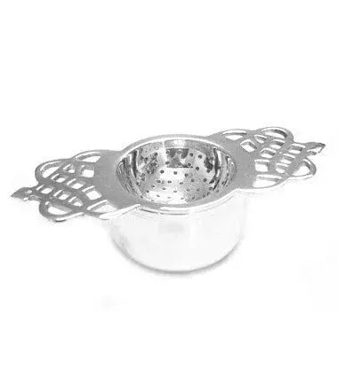 Stainless steel tea strainer with decorative handles, perfect for cozy farmhouse kitchen decor