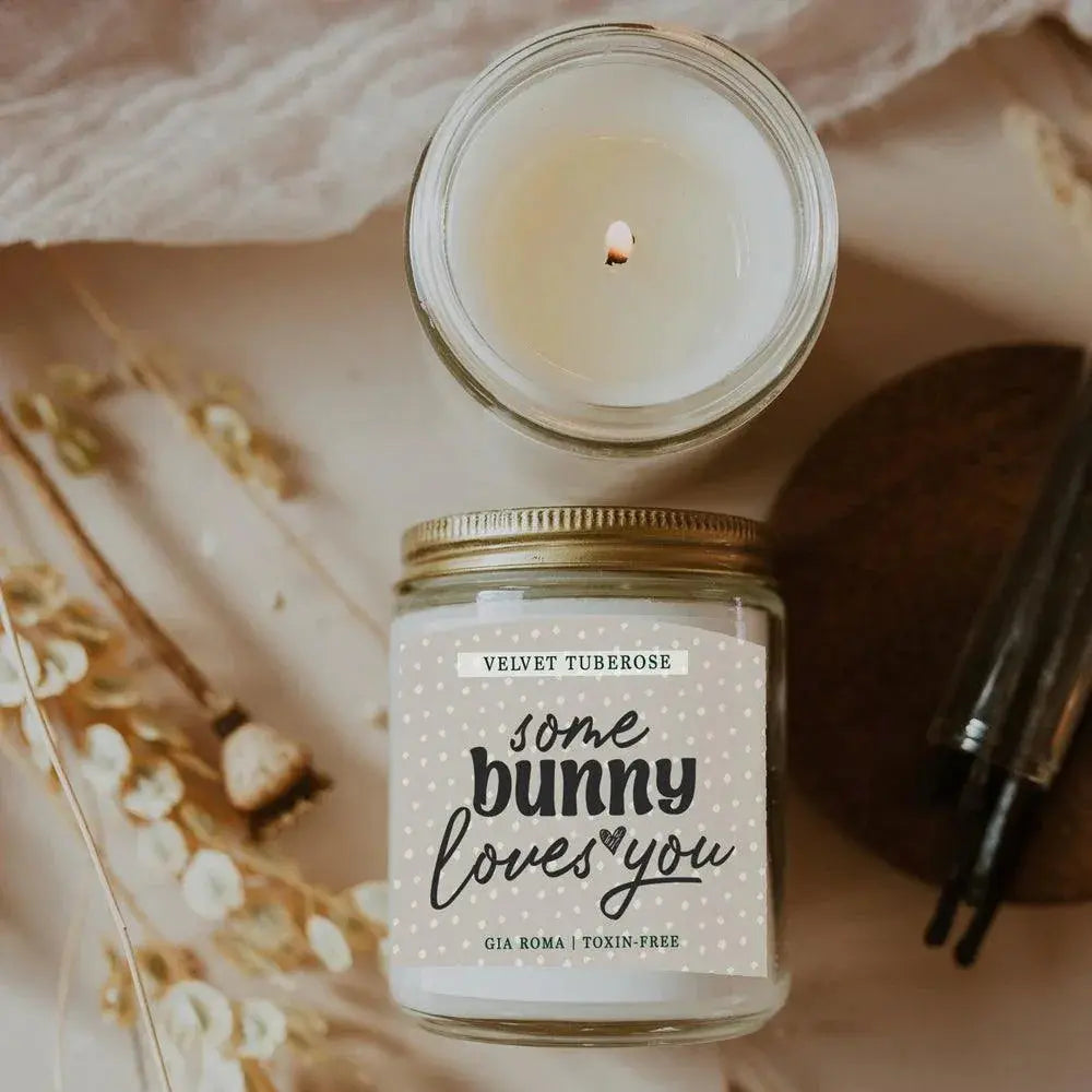 Candle in a jar with a decorative label on a soft background