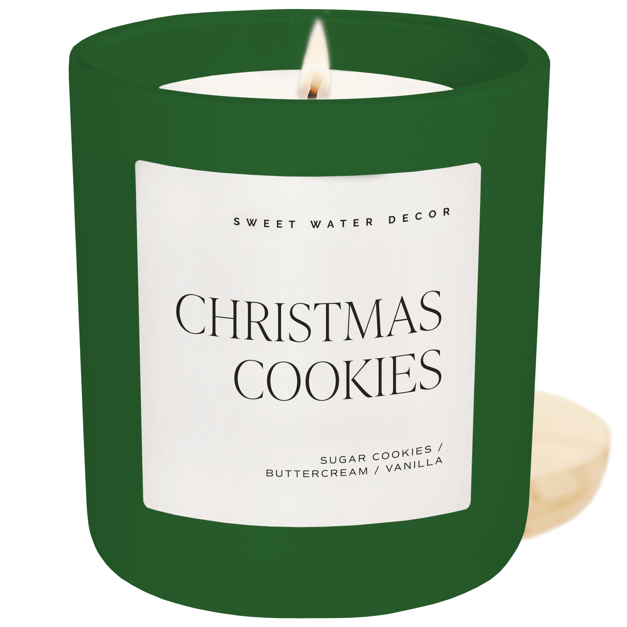 Green candle labeled 'Christmas Cookies' by Sweet Water Decor on a teal background