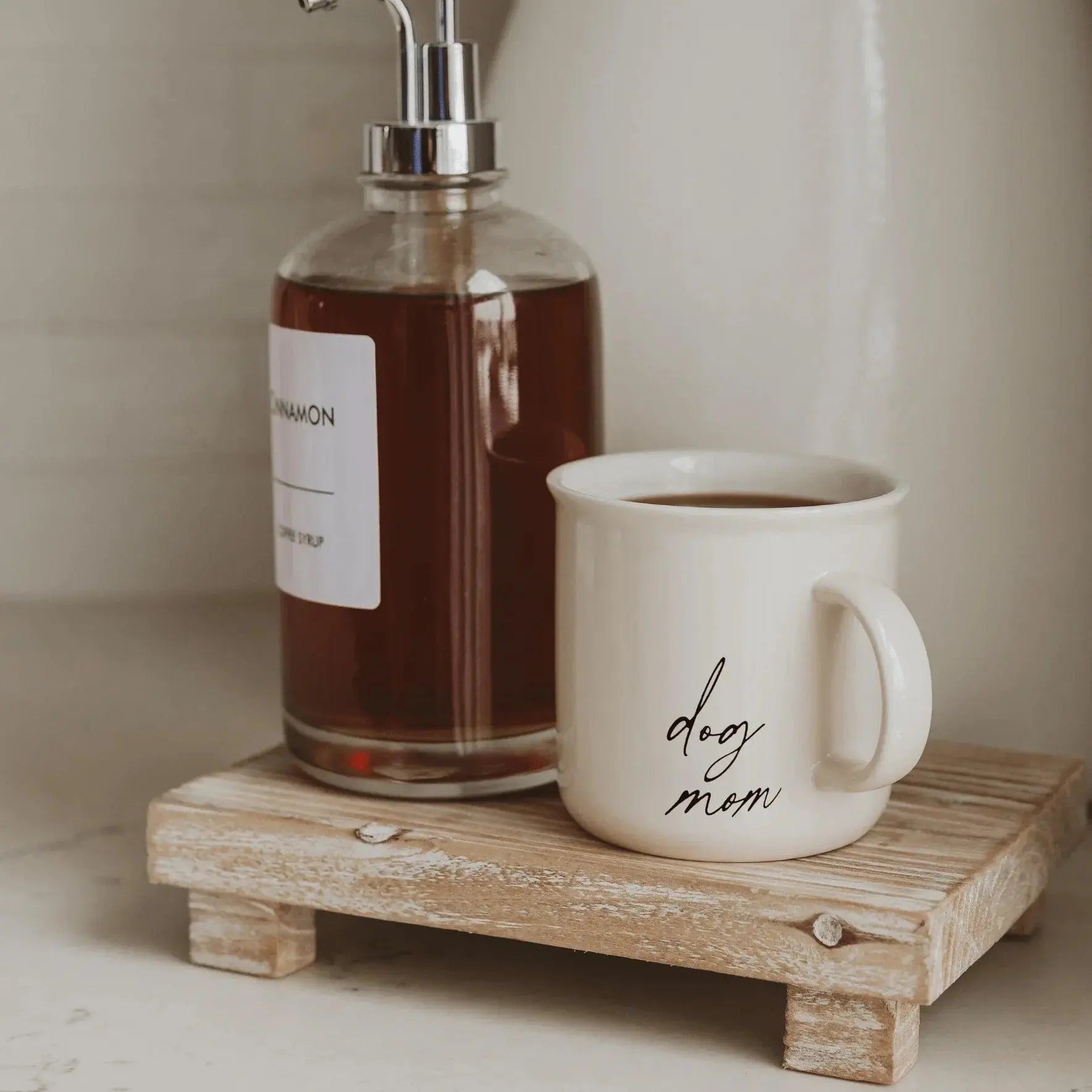 Dog mom ceramic mug with cinnamon soap dispenser on rustic wood tray, cozy farmhouse bathroom decor