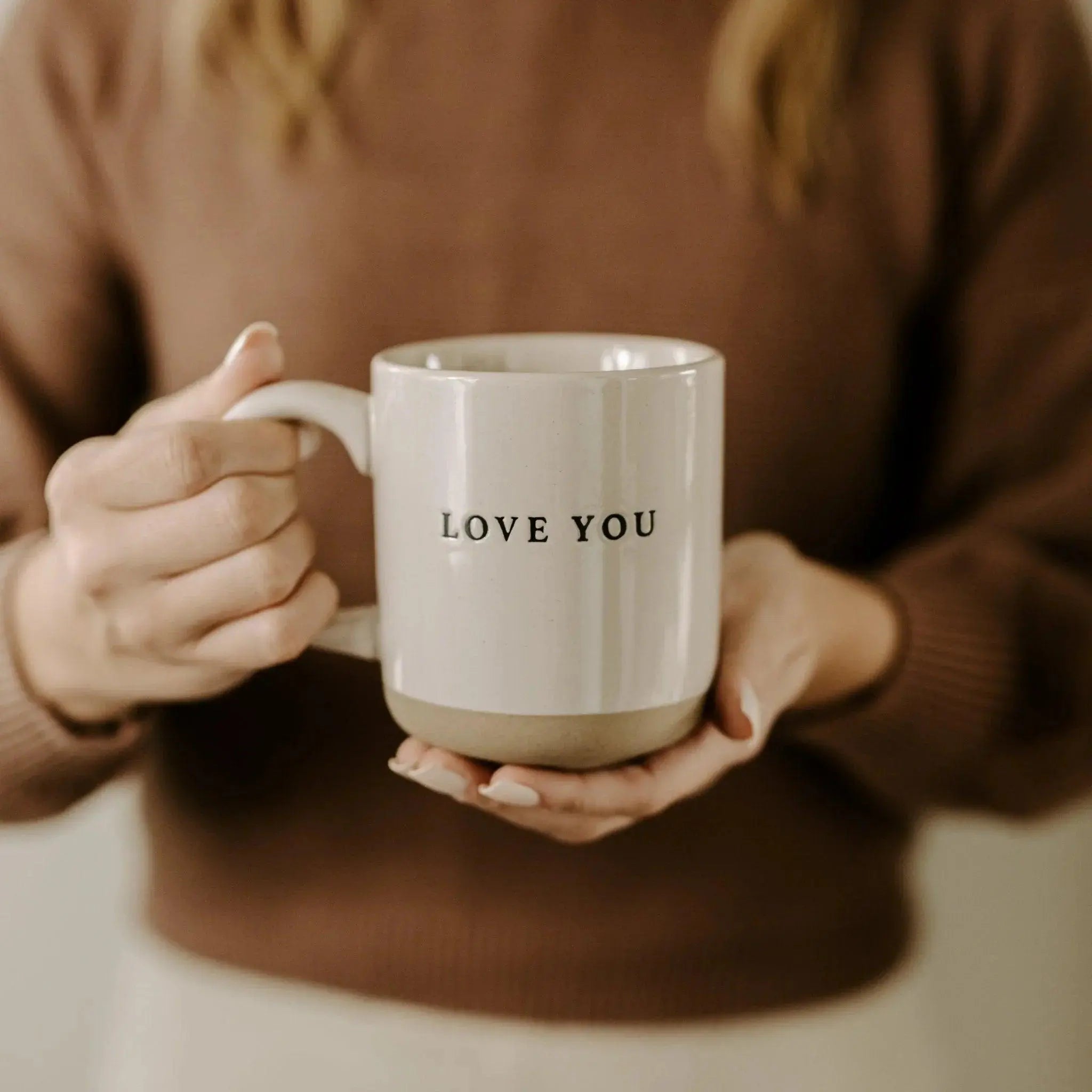 Cozy farmhouse mug with 'LOVE YOU' text, held in hands for warm home decor or thoughtful gift