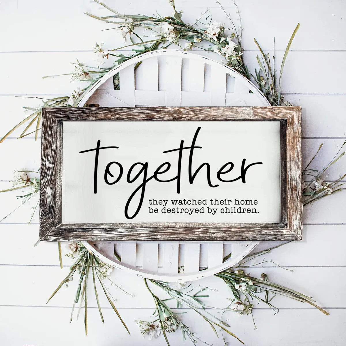 Wooden sign with the word 'Together' and text on a white background with greenery.