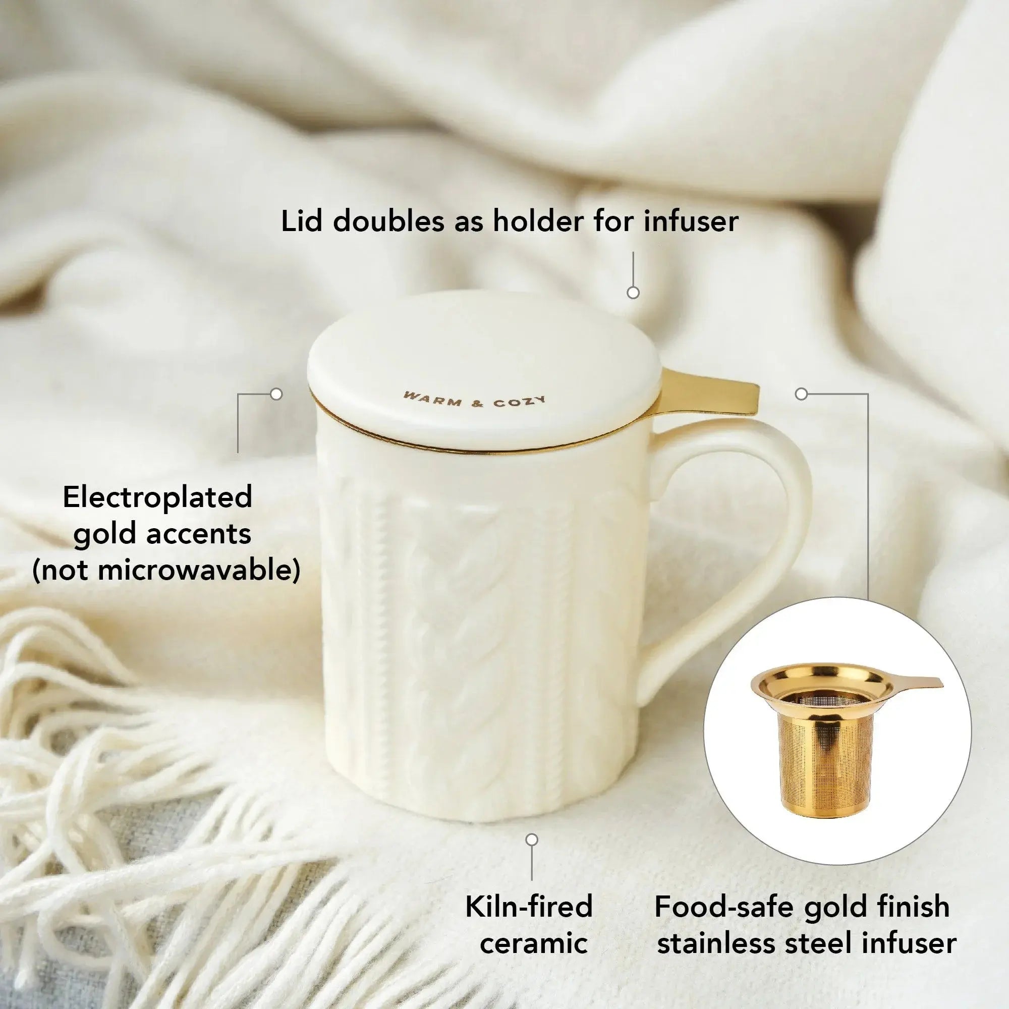 White mug with gold accents on a soft fabric background, featuring text describing its features.