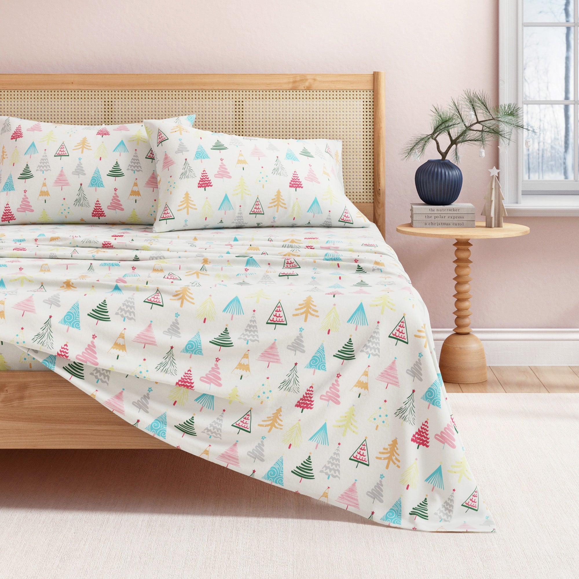 Bed with colorful tree-patterned bedding in a bedroom setting.